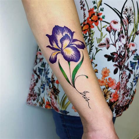 Realistic birth flower bouquet tattoo s on the arm. May birth flower tattoo in a gradient of colour on the lower back. Minimalist family birth flower tattoos on the chest. February birth flower tattoos in bright colours on the upper arm. September birth flower tattoos with realistic detailing on the neck.